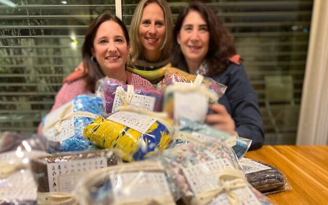 Left to right: Kate Gerstler, Shawna Goodman Sone and Saven Hilkowitz, the knitters behind 'Scarves of Love' for the hostages held in Gaza. (Courtesy) Left to right: Kate Gerstler, Shawna Goodman Sone and Saven Hilkowitz, the knitters behind 'Scarves of Love' for the hostages held in Gaza. (Courtesy)