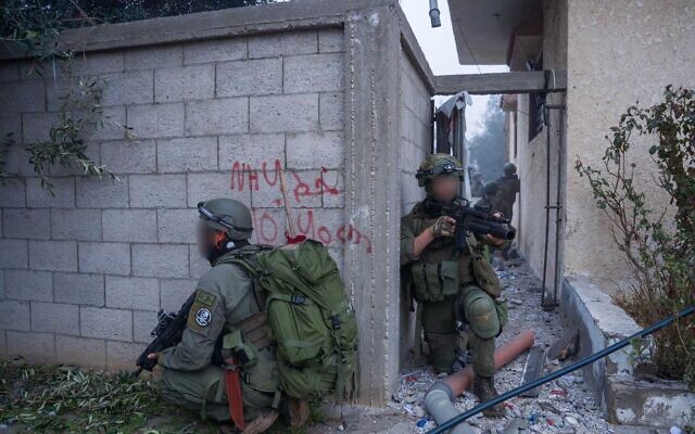 Troops of the 646th Reserve Paratroopers Brigade operate in Khan Younis, in a handout image published February 13, 2024. (Israel Defense Forces)