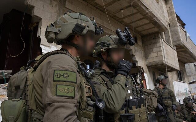 IDF troops seen operating in Gaza in this handout photo cleared for publication on February 26, 2024. (IDF)