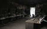 Memorial candles line the charred desks in the destroyed command center of Nahal Oz base, February 23, 2024. (Used in accordance with Clause 27a of the Copyright Law)