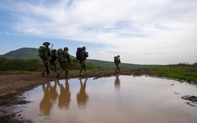 Troops drill near the northern border with Lebanon, in a handout image cleared for publication by the IDF on February 18, 2024. (Israel Defense Forces)