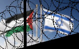 Illustrative: Flags of Israel and the Palestinian Authority wave behind barbed wire (Bartolomiej Pietrzyk/Shutterstock.com)