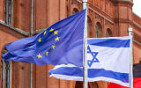 Illustrative: The Israeli flag flies along the EU flag in a show of solidarity with Israel at Rotes Rathaus (Red City Hall) in Berlin, October 2023. (philip1234/Shutterstock.com)