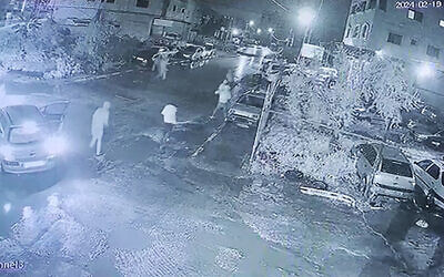 Screen capture from video of assailants carrying out vandalism in the Palestinian West Bank town of Huwara, February 18, 2024. (X. Used in accordance with Clause 27a of the Copyright Law)