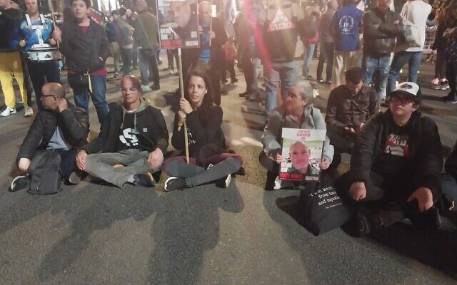 Protesters block a road in Tel Aviv on March 9, 2024. (Iddo Schejter / Times of Israel)