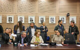 Chairman of the West Bank sub-committee of the Knesset Foreign Affairs and Defense Committee MK Tzvi Succot gestures to Labor MK Gilad Kariv to leave a hearing on alleged unlawful activity of civil rights and pro-Palestinian activists in the West Bank, March 12, 2024. (Noam Moskowitz, Office of the Knesset Spokesperson)