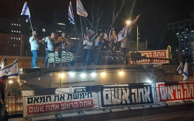 IDF veterans of the 1973 Yom Kippur War call for Prime Minister Benjamin Netanyahu to be removed from power during a weekly protest in Tel Aviv, March 23, 2024. (Iddo Schejter)