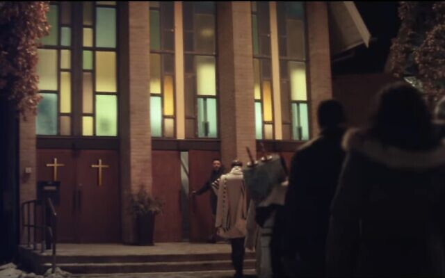 The 'Neighbors' ad depicts a church welcoming in a nearby synagogue after a bar mitzvah service was interrupted by a bomb threat. (Screenshot, used in accordance with Clause 27a of the Copyright Law) The 'Neighbors' ad depicts a church welcoming in a nearby synagogue after a bar mitzvah service was interrupted by a bomb threat. (Screenshot, used in accordance with Clause 27a of the Copyright Law)
