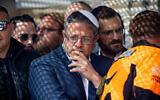 National Security Minister Itamar Ben Gvir attends the funeral of Rabbi Yitzhak Zeiger, who was killed in a terror attack near Eli, in Jerusalem, March 1, 2024. (Yonatan Sindel/Flash90)