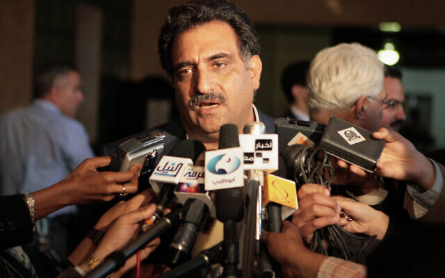 File - Former Balad MK Azmi Bishara talks to reporters at a press conference in Cairo, 22 April 2007, after he resigned at the Israeli embassy in Cairo and told Al-Jazeera satellite channel he would not return to Israel where he is under investigation. (Khaled Desouki/AFP)