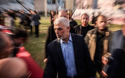 Yahya Sinwar, the Gaza Strip chief of the Palestinian Hamas terror group, greets supporters as he arrives at a rally marking Al-Quds (Jerusalem) Day, April 14, 2023. (Mohammed Abed/AFP)
