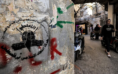 The logo of the Palestinian Islamic Jihad movement at the Shatila camp for Palestinian refugees in a southern suburb of Beirut on November 7, 2023. (Photo by AHMAD AL-RUBAYE / AFP)