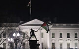 File: A pro-Palestinian demonstrator waves a Palestinian flag near the White House during the "March on Washington for Gaza" in Washington, DC, on January 13, 2024. (ROBERTO SCHMIDT / AFP)