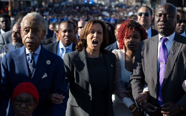 US Vice President Kamala Harris (2nd L), Civil rights attorney Ben Crump (R) and the Reverend Al Sharpton (L) join a march across the Edmund Pettus Bridge during a commemoration of the 59th anniversary of Bloody Sunday in Selma, Alabama, March 3, 2024. (SAUL LOEB / AFP)