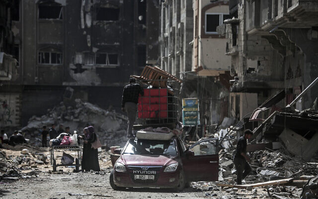 Displaced Palestinians prepare to transport their belongings in a car along a street in Khan Younis in the southern Gaza Strip on March 6, 2024, amid the ongoing conflict between Israel and the Hamas terror group. (AFP) Displaced Palestinians prepare to transport their belongings in a car along a street in Khan Younis in the southern Gaza Strip on March 6, 2024, amid the ongoing conflict between Israel and the Hamas terror group. (AFP)