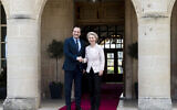 Cyprus' President Nikos Christodoulides (L) and President of the European Commission Ursula von der Leyen (R) shake hands at the presidential palace in Nicosia on March 8, 2024. (Iakovos Hatzistavrou / POOL / AFP)