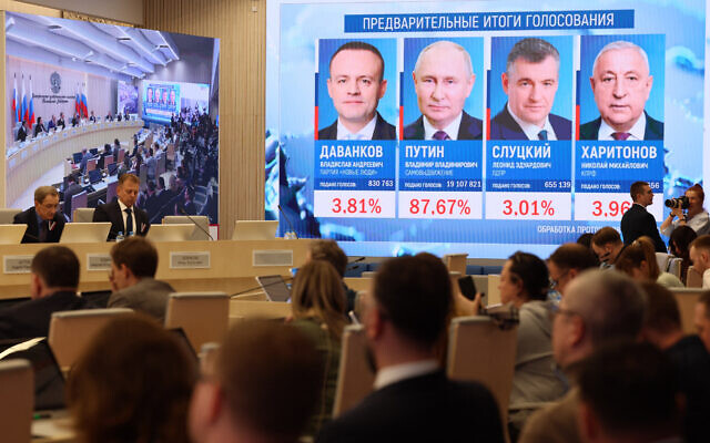 Preliminary voting results in the Russian presidential election are displayed on a screen at the Central Election Commission in Moscow on March 17, 2024. (STRINGER / AFP) Preliminary voting results in the Russian presidential election are displayed on a screen at the Central Election Commission in Moscow on March 17, 2024. (STRINGER / AFP)