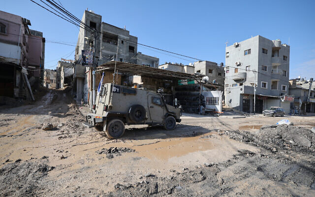 An Israeli armored vehicle drives on a road following a raid at the Nur Shams camp for Palestinian refugees near Tulkarm on March 21, 2024 (Jaafar ASHTIYEH / AFP) An Israeli armored vehicle drives on a road following a raid at the Nur Shams camp for Palestinian refugees near Tulkarm on March 21, 2024 (Jaafar ASHTIYEH / AFP)