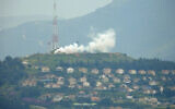 Smoke billowing in the northern border town of Metula as it was targeted by projectiles fired from terror groups in Lebanon, as seen from the southern Lebanon town of Marjayoun, March 21, 2024. (Rabih Daher/AFP)