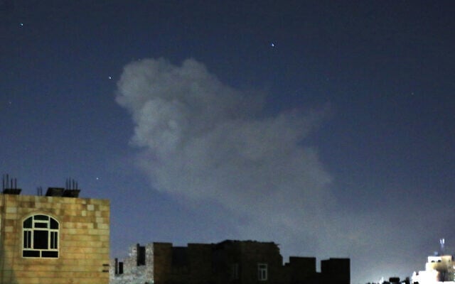 A plume of smoke rises after a reported airstrike in the Yemeni capital Sanaa on March 22, 2024. (Mohammed Huwais/AFP) A plume of smoke rises after a reported airstrike in the Yemeni capital Sanaa on March 22, 2024. (Mohammed Huwais/AFP)
