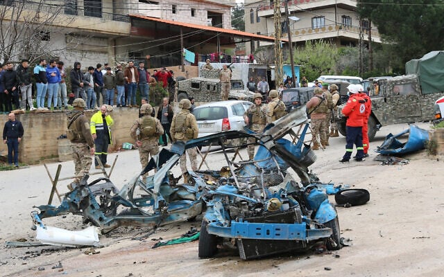 Lebanese soldiers cordon off the site of an alleged Israeli drone attack targeting a vehicle in the town of Souairi, in western Bekaa Valley in central Lebanon on March 24, 2024. (Hassan Jarrah/AFP)