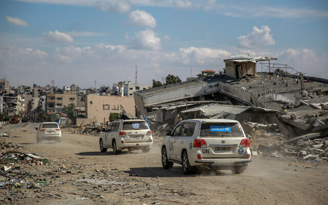 UN vehicles drive around buildings destroyed in previous Israeli strikes Gaza City, on March 25, 2024. (AFP) UN vehicles drive around buildings destroyed in previous Israeli strikes Gaza City, on March 25, 2024. (AFP)