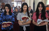 Palestinian Christians celebrate Easter Sunday Mass at the Catholic Holy Family Church in Gaza City, on March 31, 2024. (AFP)