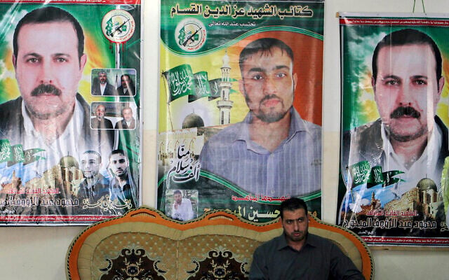 Palestinian Faiq Mabhouh sits in front of posters of his brother Hamas commander Mahmoud Mabhouh, left and right, who was assassinated in Dubai, and Hamas member Mohammed Hussein Mabhouh, in the family house in Jabaliya, northern Gaza Strip, February 16, 2010. (AP Photo/Khalil Hamra) Palestinian Faiq Mabhouh sits in front of posters of his brother Hamas commander Mahmoud Mabhouh, left and right, who was assassinated in Dubai, and Hamas member Mohammed Hussein Mabhouh, in the family house in Jabaliya, northern Gaza Strip, February 16, 2010. (AP Photo/Khalil Hamra)