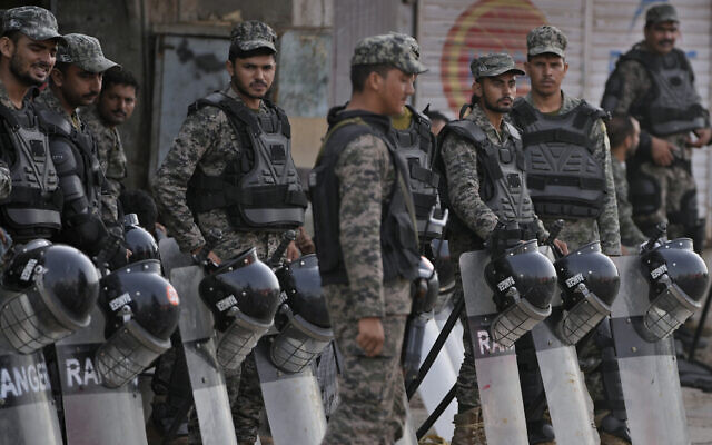Paramilitary troops stand guard with riot gear to ensure security following attacks by a Muslim mob angry over allegations that a Christian man had desecrated the Quran near Faisalabad, Pakistan, Thursday, Aug. 17, 2023. (AP/K.M. Chaudary) Paramilitary troops stand guard with riot gear to ensure security following attacks by a Muslim mob angry over allegations that a Christian man had desecrated the Quran near Faisalabad, Pakistan, Thursday, Aug. 17, 2023. (AP/K.M. Chaudary)