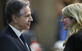 U.S. Secretary of State Antony Blinken, left, talks with Canada's Foreign Minister Melanie Joly during the G20 foreign ministers meeting in Rio de Janeiro, Brazil, Wednesday, Feb. 21, 2024. (AP Photo/Silvia Izquierdo)