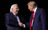 Then-Republican presidential candidate, US President Donald Trump, right, greets David Friedman, who served as his ambassador to Israel, at the National Religious Broadcasters convention at the Gaylord Opryland Resort and Convention Center on February 22, 2024, in Nashville, Tennessee. (AP Photo/George Walker IV)