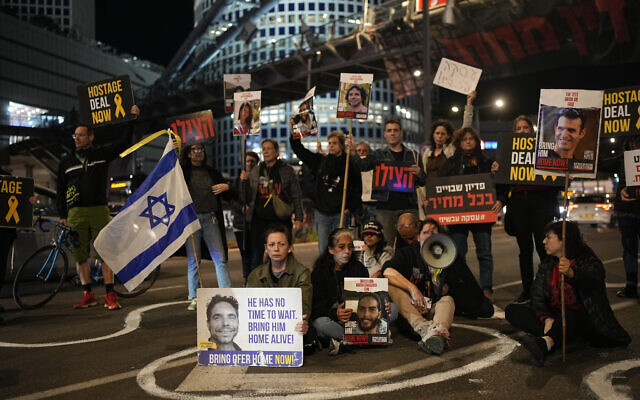 People block a street during a protest calling for a deal to release the hostages held in the Gaza Strip by the Hamas terrorist group, in Tel Aviv, Feb. 29, 2024. (AP Photo/Ohad Zwigenberg) People block a street during a protest calling for a deal to release the hostages held in the Gaza Strip by the Hamas terrorist group, in Tel Aviv, Feb. 29, 2024. (AP Photo/Ohad Zwigenberg)