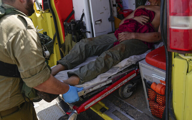 Israeli security forces in Kiryat Shoma evacuate a wounded Thai man after he was hit by an anti-tank missile fired from Lebanon, March 4, 2024. (AP Photo/Ariel Schalit) Israeli security forces in Kiryat Shoma evacuate a wounded Thai man after he was hit by an anti-tank missile fired from Lebanon, March 4, 2024. (AP Photo/Ariel Schalit)
