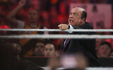 Manager Paul Heyman communicates with Brock Lesnar at WrestleMania XXXI in Santa Clara, California, March 29, 2015. (Don Feria/AP Images for WWE, File)