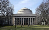 Students walk past the "Great Dome" atop Building 10 on the Massachusetts Institute of Technology campus in Cambridge, Mass, April 3, 2017.  (AP Photo/Charles Krupa, File)