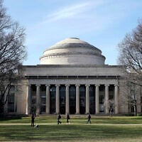 Students walk past the "Great Dome" atop Building 10 on the Massachusetts Institute of Technology campus in Cambridge, Mass, April 3, 2017.  (AP Photo/Charles Krupa, File)