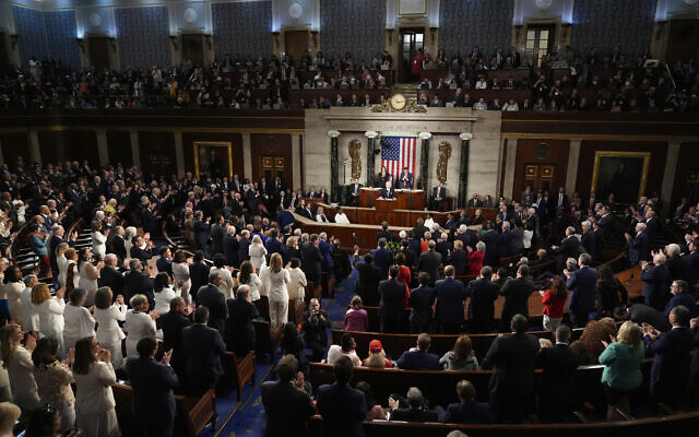 Both Democrats and Republicans stand to applaud as President Joe Biden speaks about former Rep. John Lewis, as he delivers the State of the Union address to a joint session of Congress at the U.S. Capitol, Thursday March 7, 2024, in Washington. (AP Photo/Andrew Harnik) Both Democrats and Republicans stand to applaud as President Joe Biden speaks about former Rep. John Lewis, as he delivers the State of the Union address to a joint session of Congress at the U.S. Capitol, Thursday March 7, 2024, in Washington. (AP Photo/Andrew Harnik)