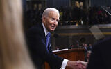 US President Joe Biden shakes hands after delivering the State of the Union address to a joint session of Congress at the Capitol, Thursday, March 7, 2024, in Washington. (Shawn Thew/Pool via AP)