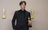 Jonathan Glazer poses with the award for best international feature film for 'The Zone of Interest,' in the press room at the Oscars on March 10, 2024, at the Dolby Theatre in Los Angeles. (Jordan Strauss/Invision/AP)