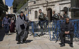Illustrative - Border Police officers stand guard as Palestinians walk by in Jerusalem's Old City on the first day of Ramadan, March 11, 2024. (AP Photo/Ohad Zwigenberg)