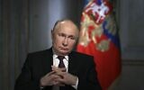 Russian President Vladimir Putin gestures while speaking during an interview with Rossiya Segodnya International Media Group in Moscow, Russia, March 12, 2024. (Gavriil Grigorov, Sputnik, Kremlin Pool Photo via AP)