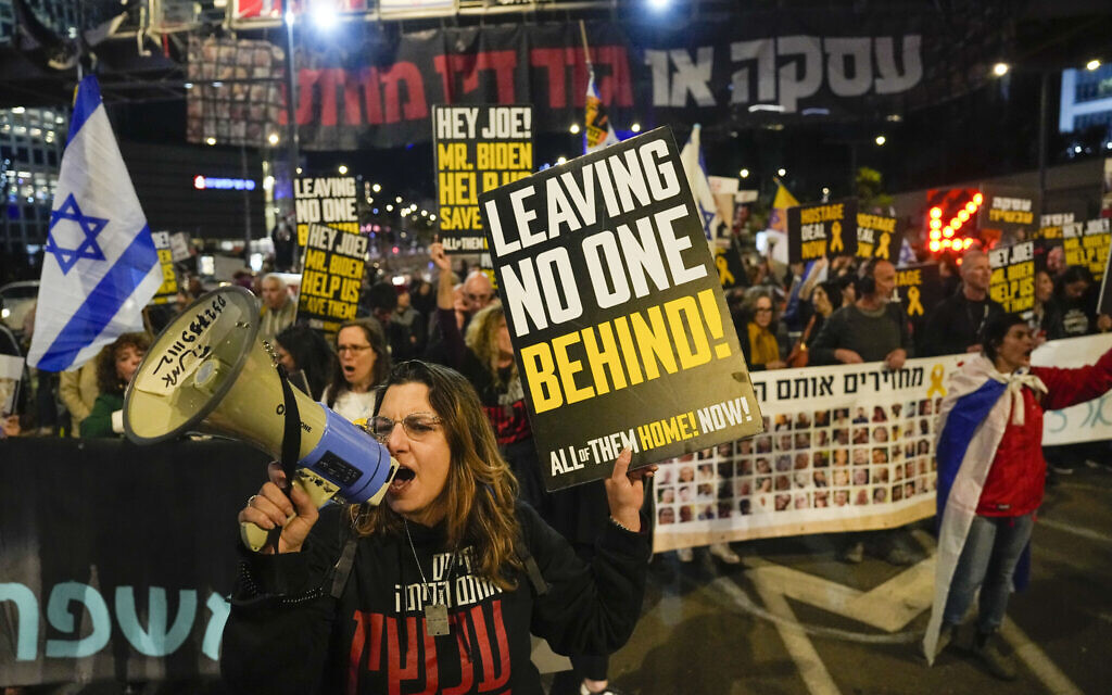 Friends and relatives of the Israeli hostages held in the Gaza Strip by the Hamas terror group attend a rally calling for their release, in Tel Aviv, March 9, 2024. (AP Photo/Ariel Schalit)