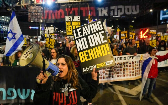 Friends and relatives of the Israeli hostages held in the Gaza Strip by the Hamas terror group attend a rally calling for their release, in Tel Aviv, March 9, 2024. (AP Photo/Ariel Schalit)