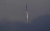 SpaceX's mega-rocket Starship cuts through clouds and haze on its third test flight from Starbase in Boca Chica, Texas, March 14, 2024. (Eric Gay/AP)