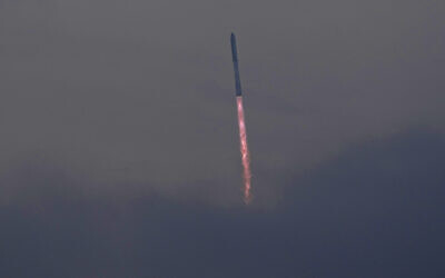 SpaceX's mega-rocket Starship cuts through clouds and haze on its third test flight from Starbase in Boca Chica, Texas, March 14, 2024. (Eric Gay/AP)