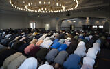 Muslim community members gather for the Jumʿah, a special noon service on Fridays that observant Muslims are obliged to attend, March 15, 2024, at the Islamic Society of Central Jersey in Monmouth Junction, New Jersey. (John Minchillo/AP)