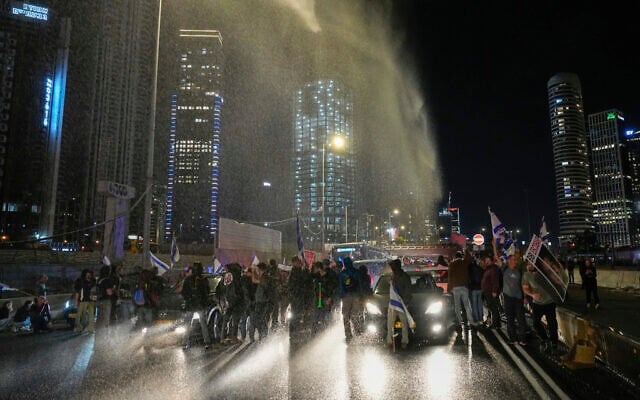 Police use a water cannon to disperse demonstrators during a protest calling for the release of Israeli hostages held in the Gaza Strip by the Hamas terror group, in Tel Aviv, Israel, Saturday, March 16, 2024. (AP/Ohad Zwigenberg)