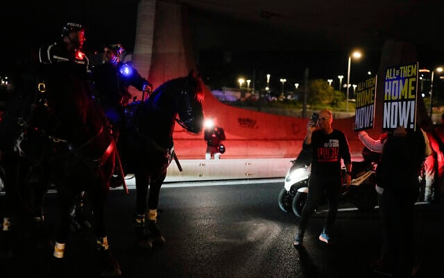 Police try to disperse demonstrators blocking a road during a protest calling for the release of Israeli hostages held in the Gaza Strip by the Hamas terror group, in Tel Aviv, Israel, Saturday, March 16, 2024. (AP/Ohad Zwigenberg)