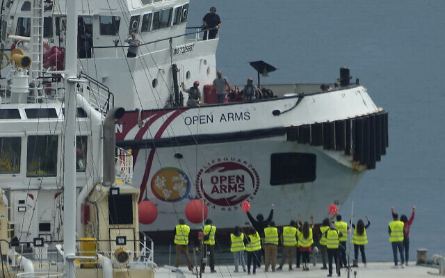 The ship Open Arms belonging to the Spanish aid group by the same name, arrives in Larnaca port after delivering 200 tons of aid to Gaza, March 17, 2024 (AP Photo/Petros Karadjias)