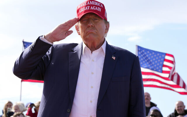 Republican presidential candidate former President Donald Trump salutes at a campaign rally March 16, 2024, in Vandalia, Ohio. (AP Photo/Jeff Dean)